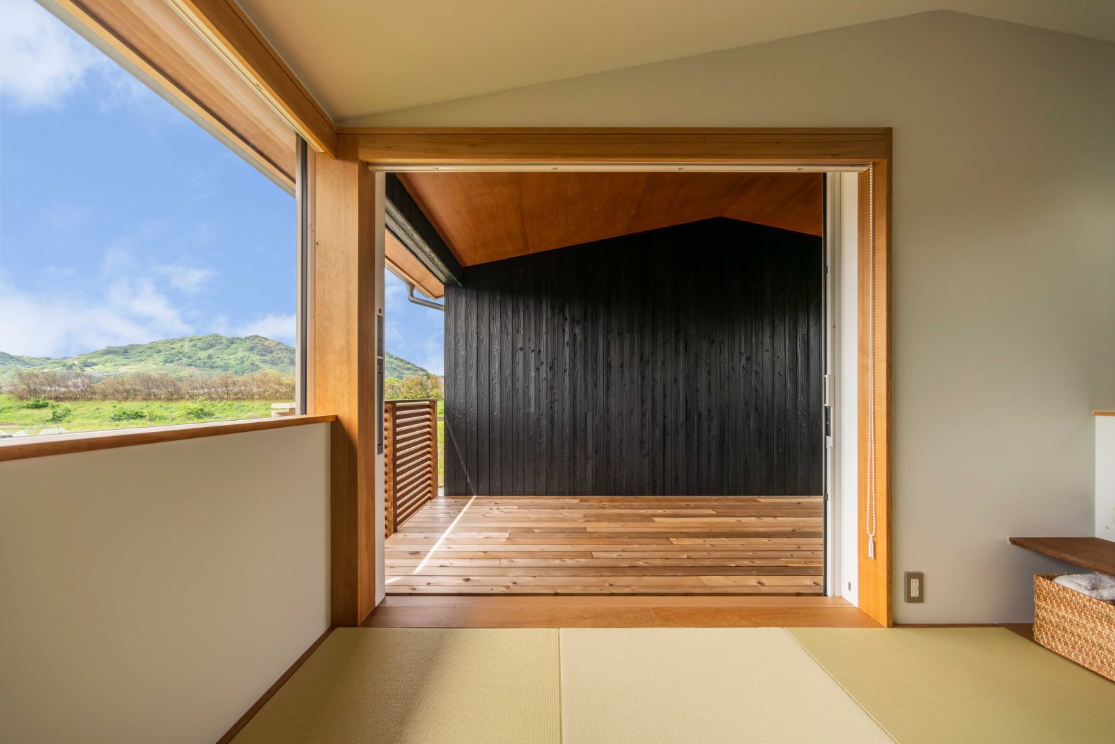 Interior view looking out to Yakisugi a.k.a Shousugiban charred cedar exterior wall.