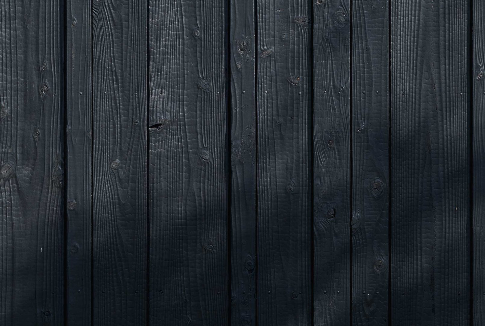 Close-up of Yakisugi a.k.a Shousugiban charred cedar cladding texture.
