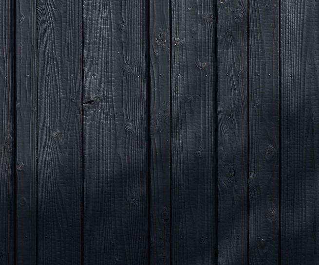 Close-up of Yakisugi a.k.a Shousugiban charred cedar cladding texture.