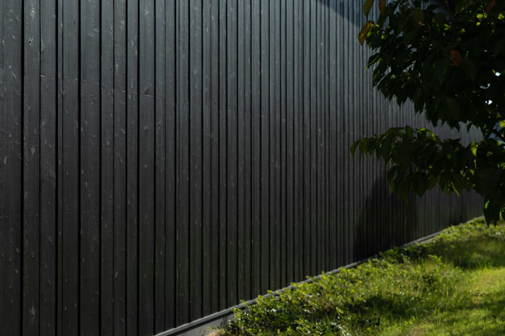 Exterior wall with Yakisugi a.k.a Shousugiban charred cedar cladding.