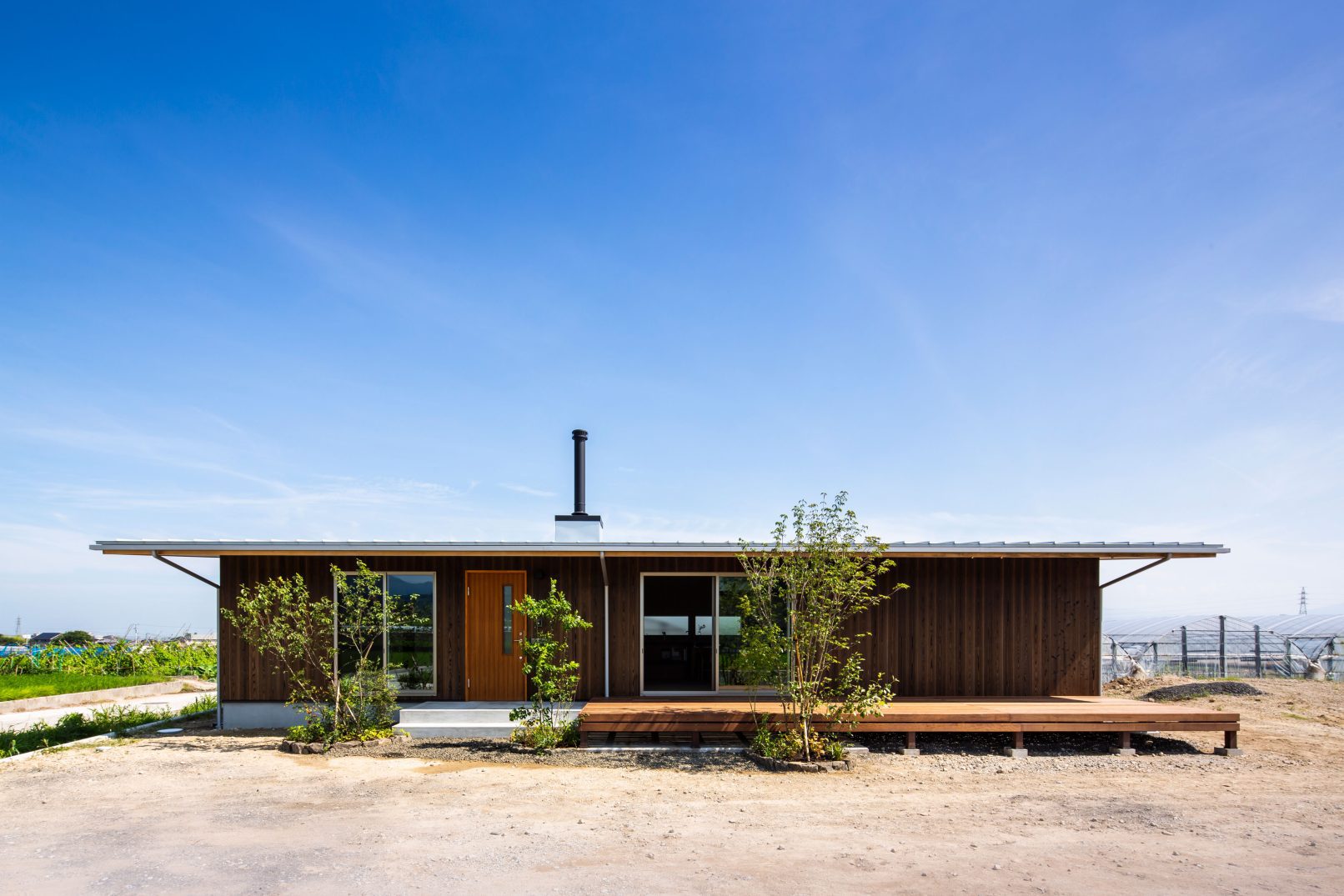 Modern rural house with Yakisugi a.k.a Shousugiban cedar cladding and wooden deck.