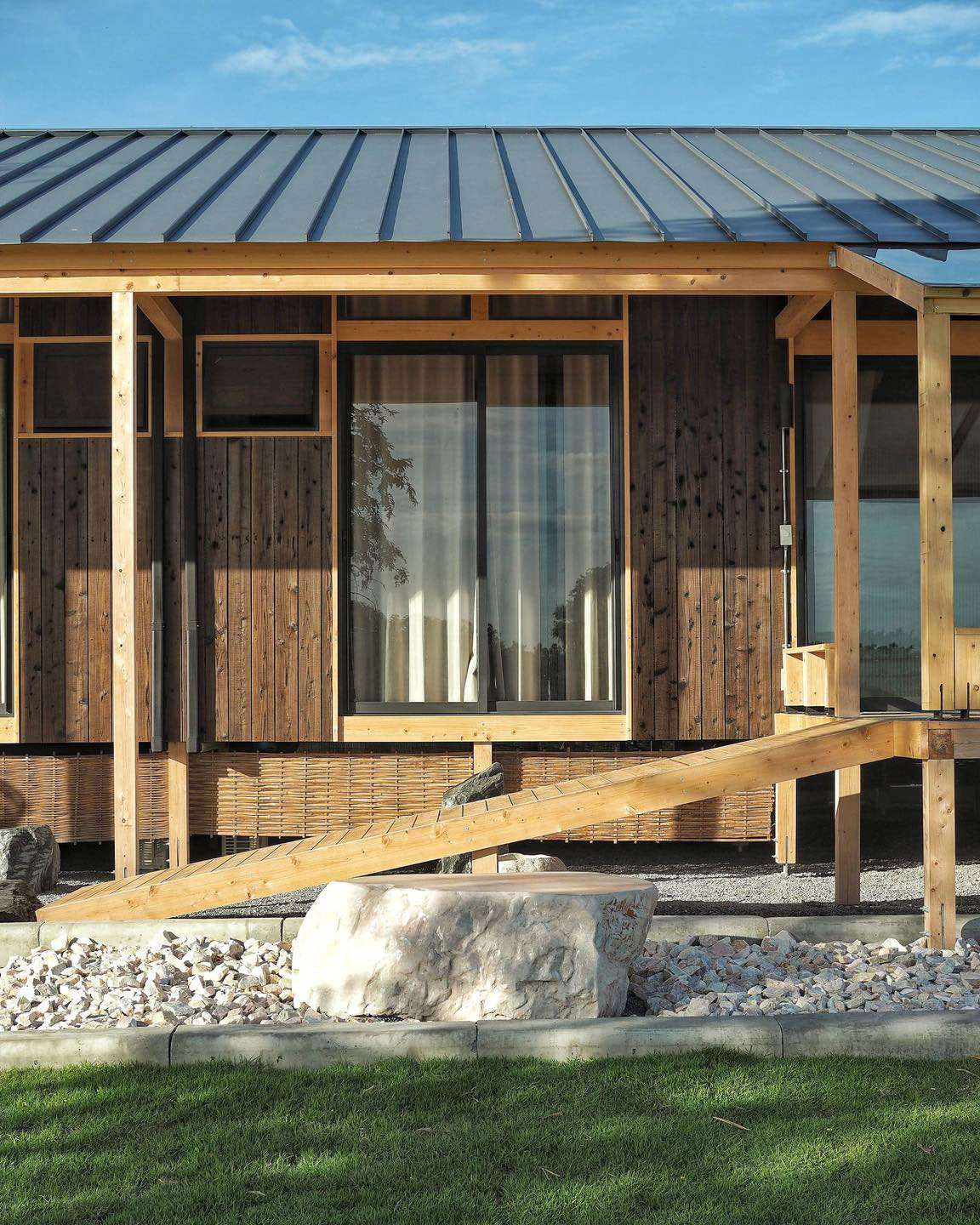 Modern house with Yakisugi a.k.a Shousugiban cedar cladding and timber ramp.