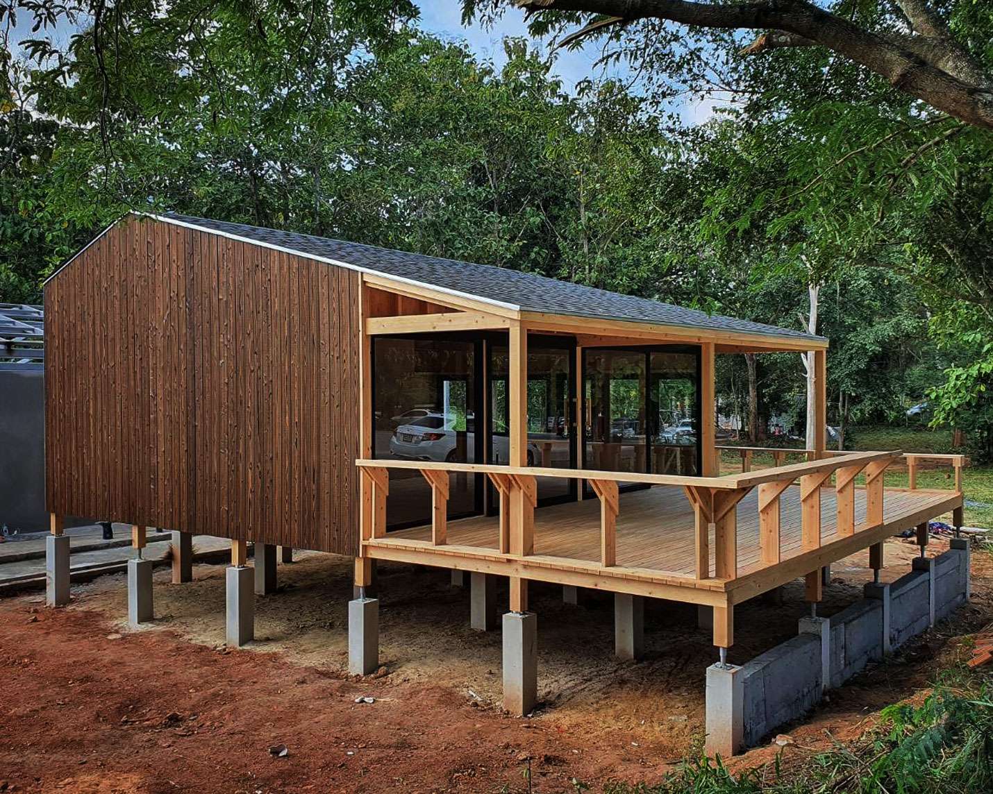 Modern cabin with Yakisugi a.k.a Shousugiban cedar cladding and timber deck.
