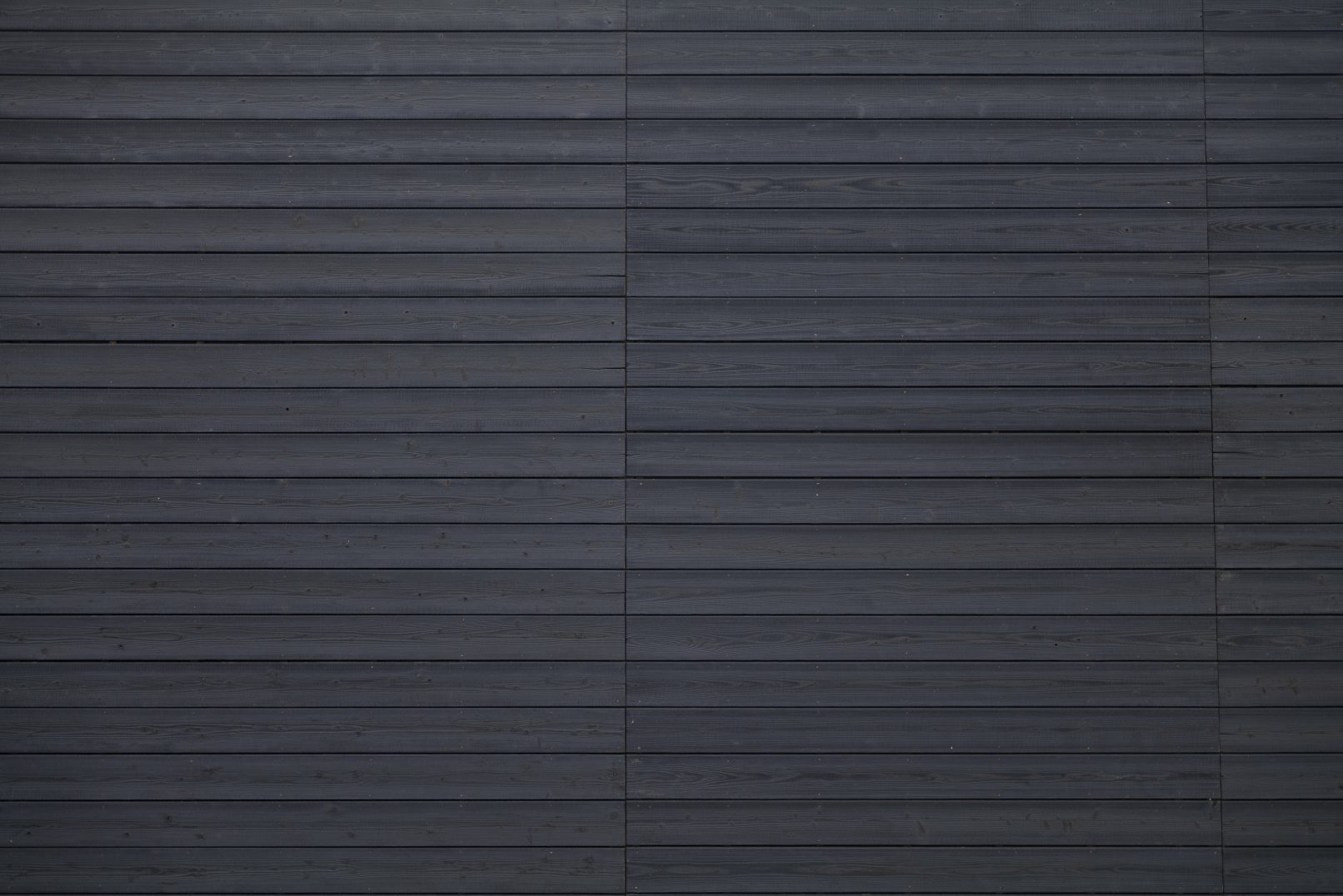 Custom black yakisugi cladding on a modern home exterior
