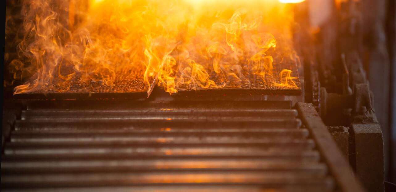 Yakisugi a.k.a Shousugiban cedar boards being charred with fire.
