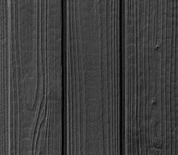 Close-up of Benii Black Yakisugi a.k.a Shousugiban cedar timber cladding showing charred wood grain texture.