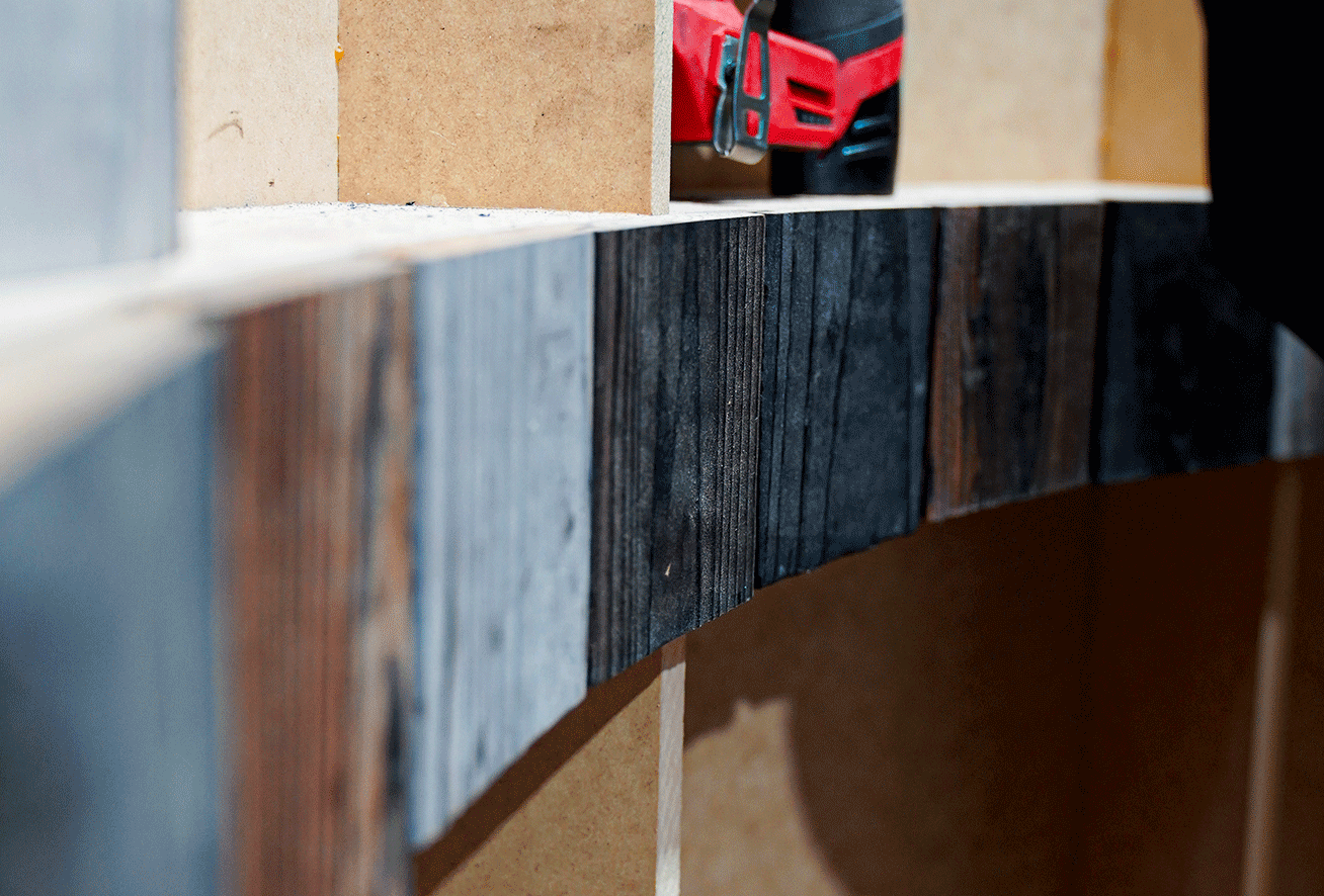 Close-up of Yakisugi a.k.a Shousugiban cedar boards being prepared in a woodworking workshop.