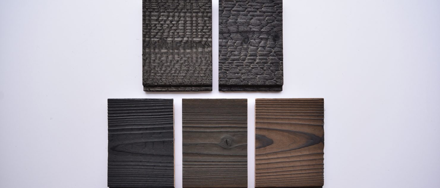 Sample boards showing different Yakisugi a.k.a Shousugiban charred cedar textures and finishes.