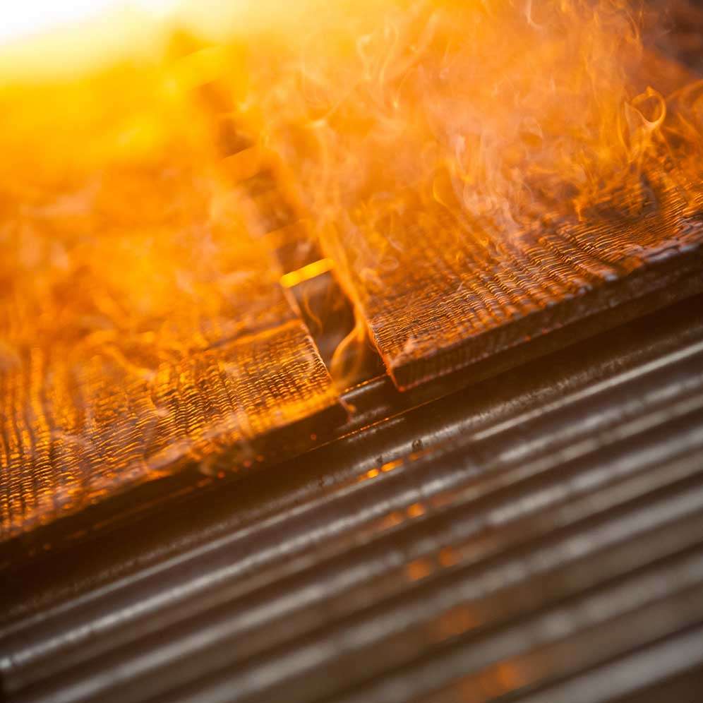Flames and smoke over textured surface Shou Sugi Ban Board